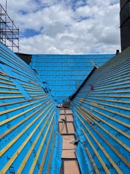 Image shows the roof with slates removed and new membrane and batons installed